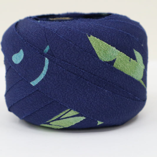 Dark blue with floral and leaf patterns in yellow-green, light blue, white, and purple (Y02312006)