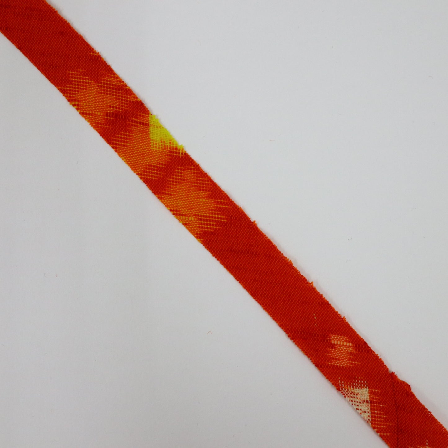 Red-orange with yellow and white kasuri pattern, wool (Y02406001)