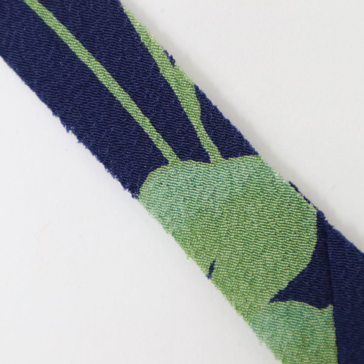 Dark blue with floral and leaf patterns in yellow-green, light blue, white, and purple (Y02312006)