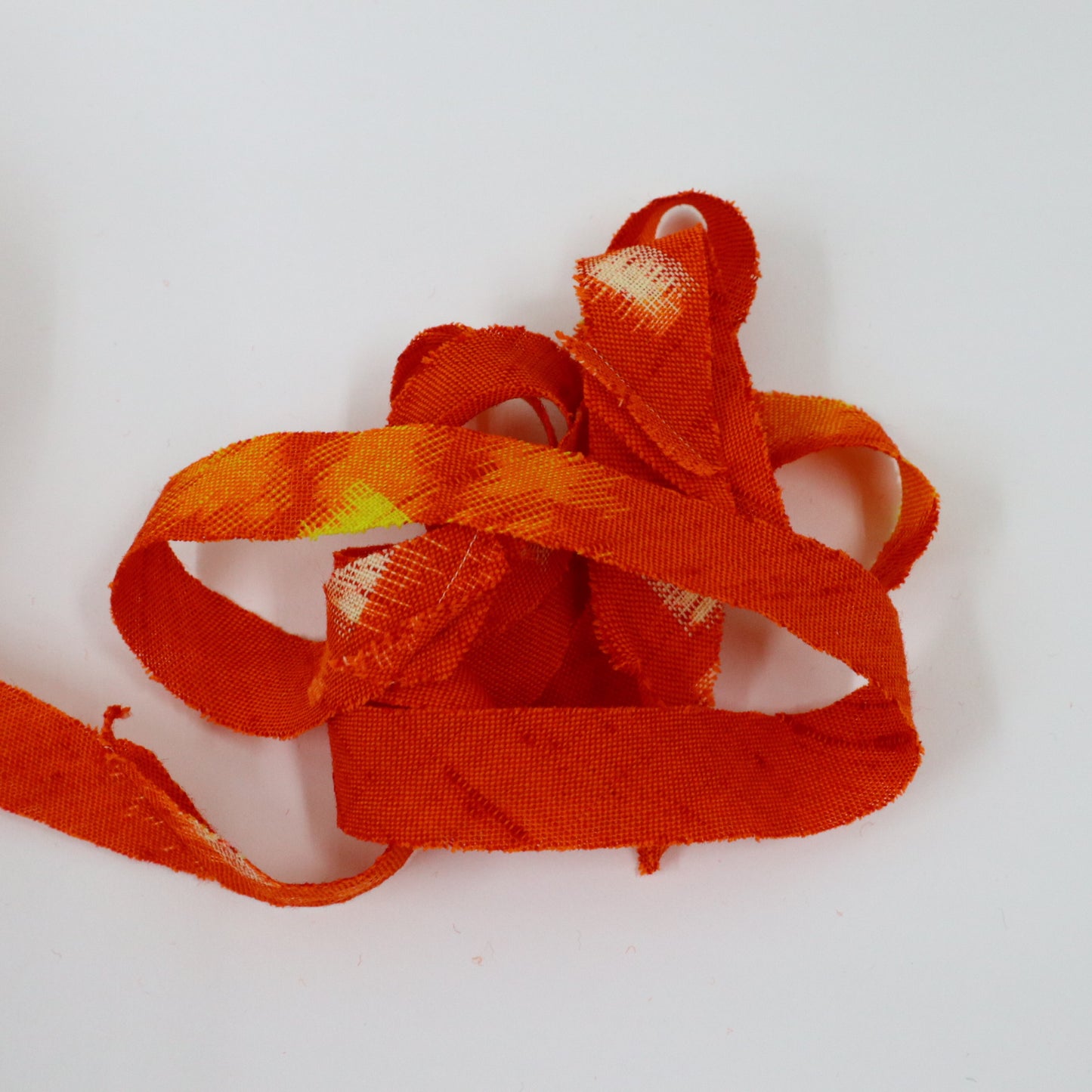 Red-orange with yellow and white kasuri pattern, wool (Y02406001)