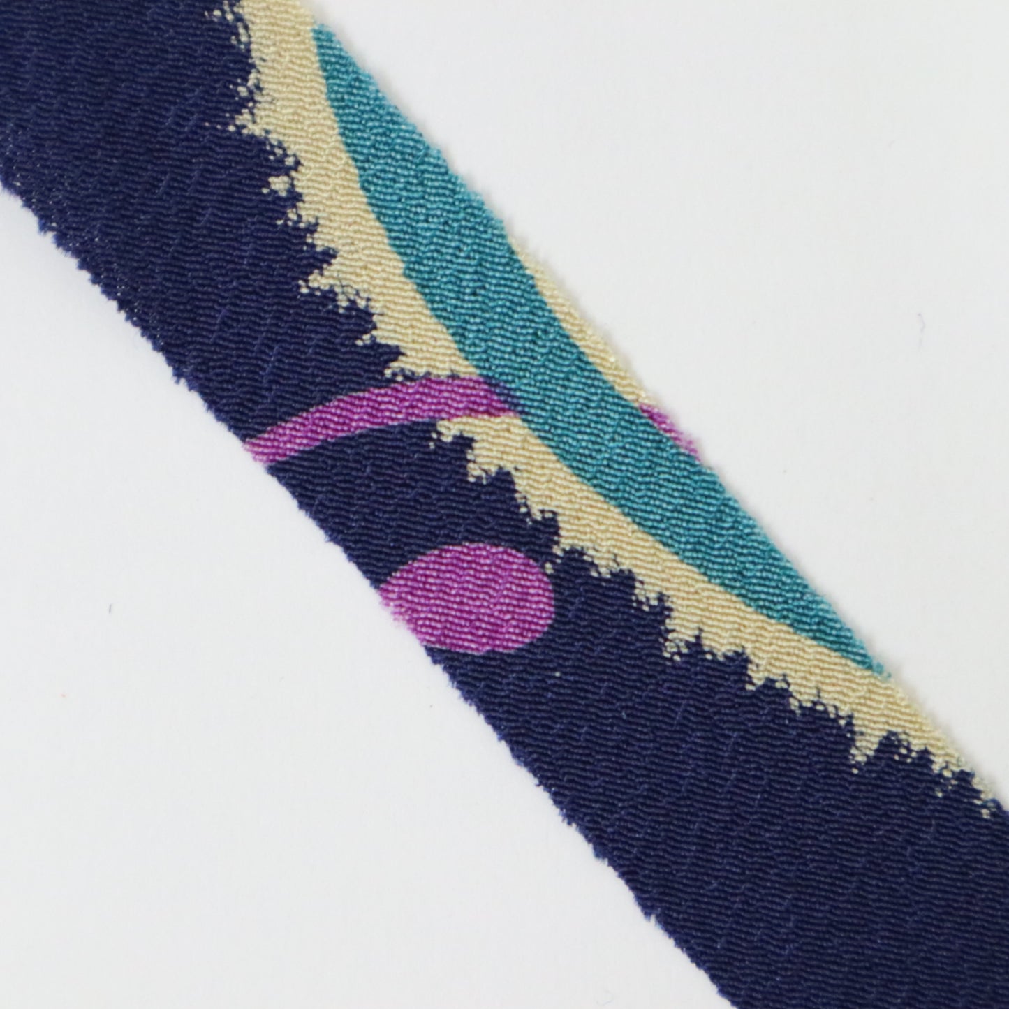 Dark blue with floral and leaf patterns in yellow-green, light blue, white, and purple (Y02312006)
