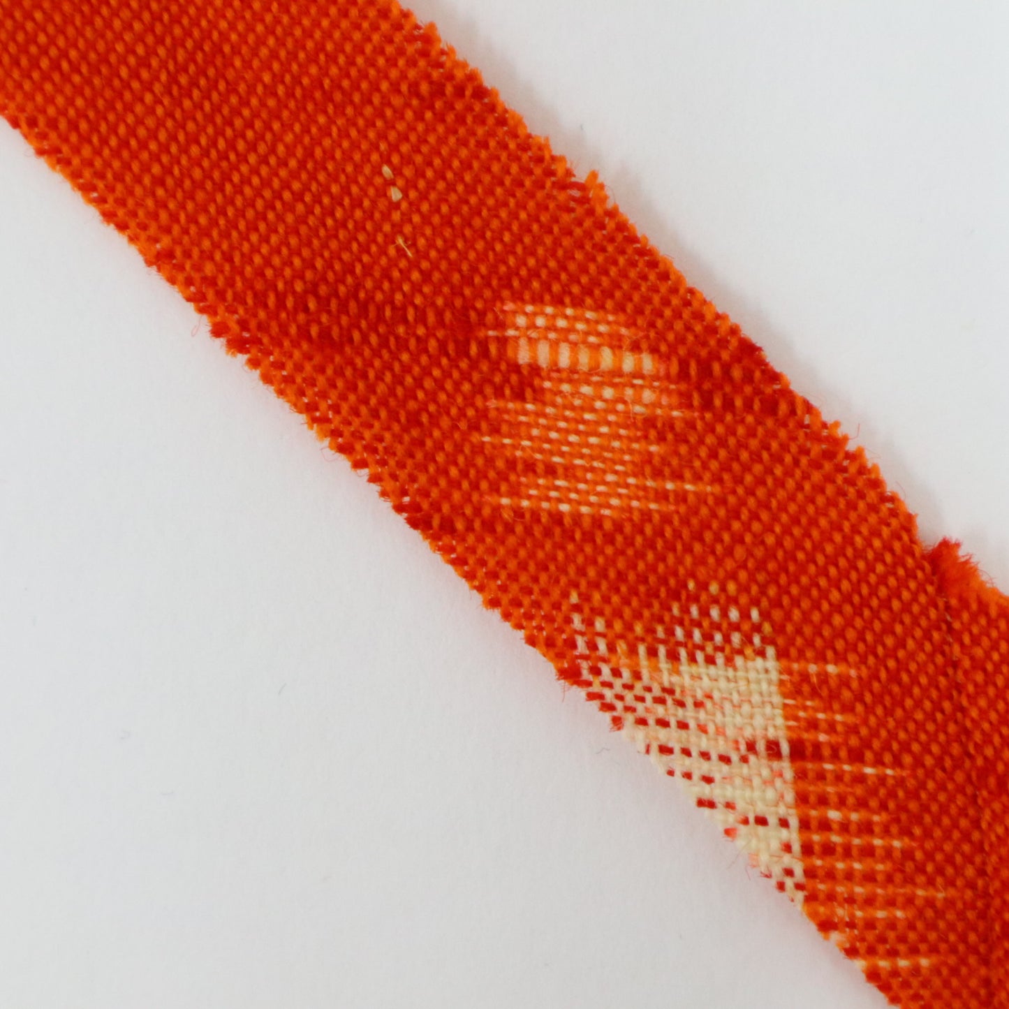Red-orange with yellow and white kasuri pattern, wool (Y02406001)