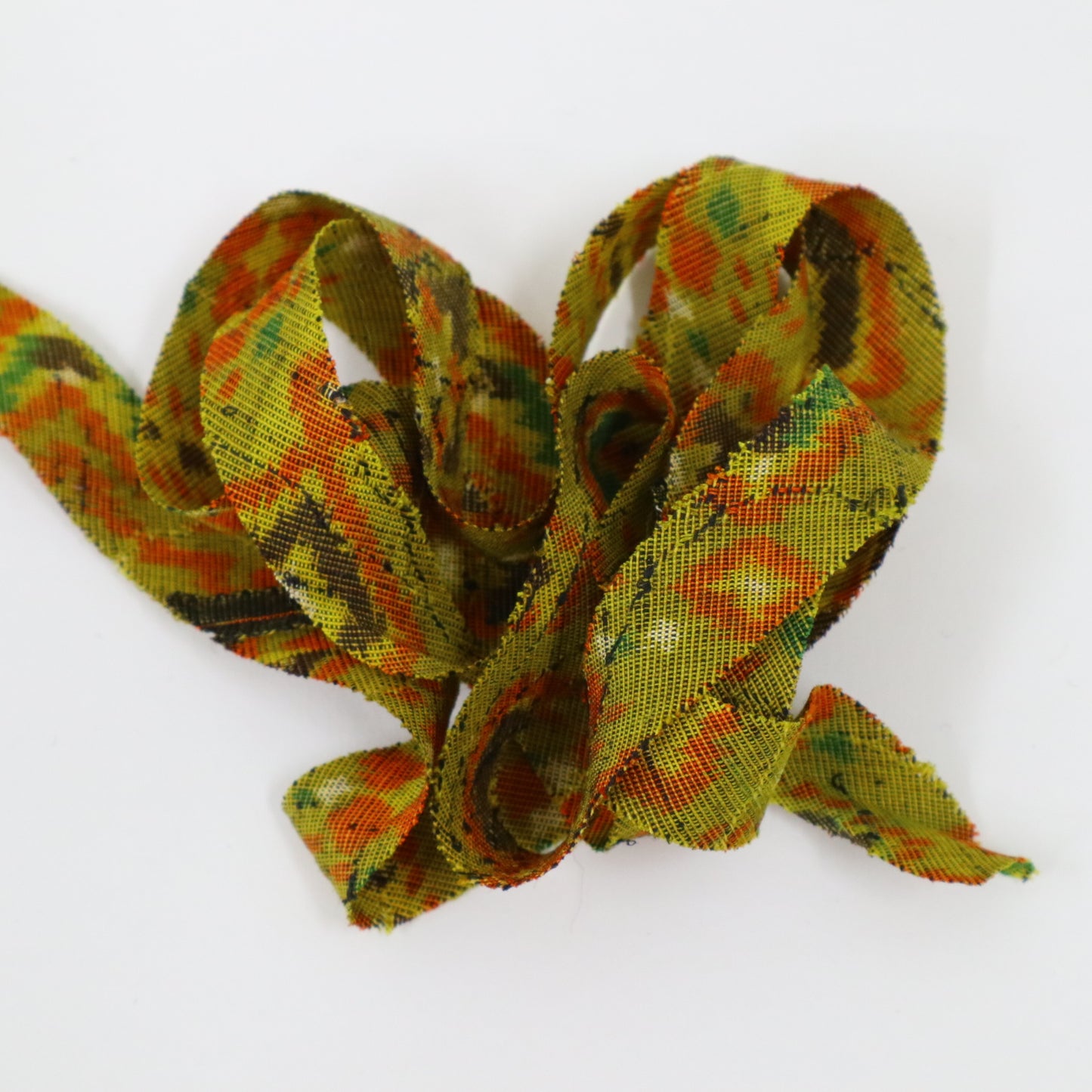Mustard green with orange, yellow, green, brown, and white geometric pattern, interwoven (Y02405005)