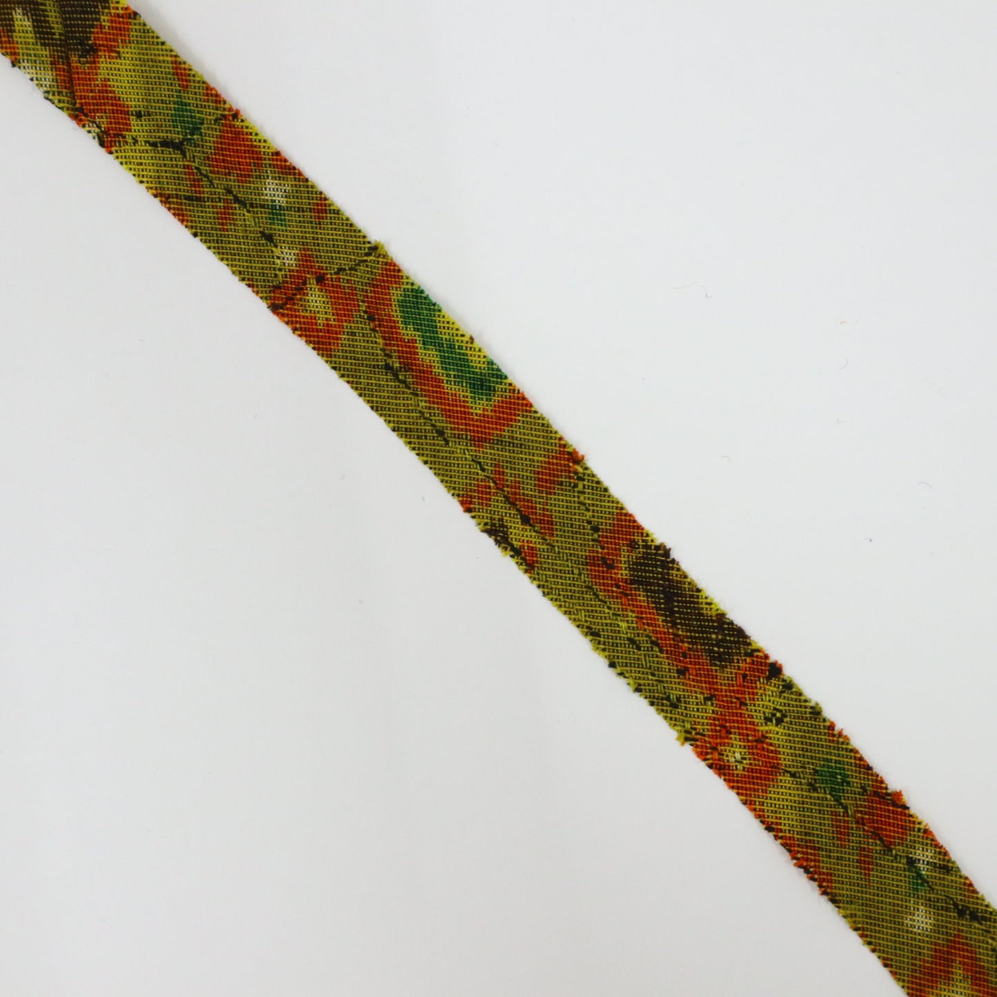 Mustard green with orange, yellow, green, brown, and white geometric pattern, interwoven (Y02405005)