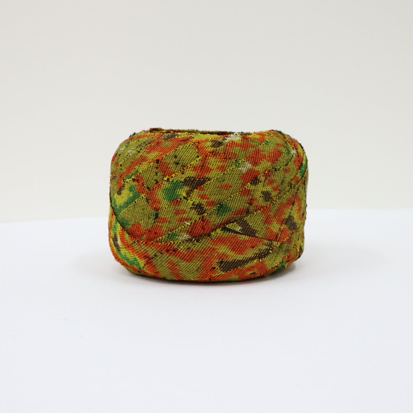 Mustard green with orange, yellow, green, brown, and white geometric pattern, interwoven (Y02405005)