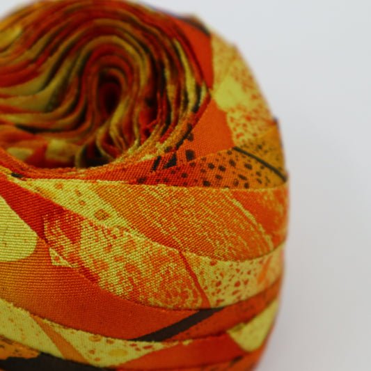 Orange with dark brown and yellow abstract pattern, crepe (Y02403012)