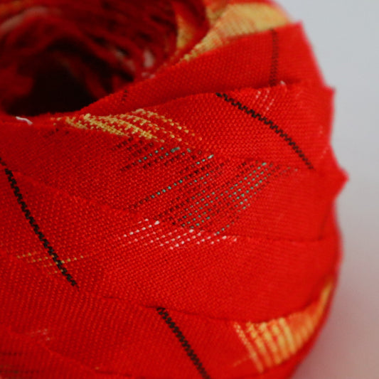 Red with yellow, white, and black ikat pattern, wool (Y02211006)