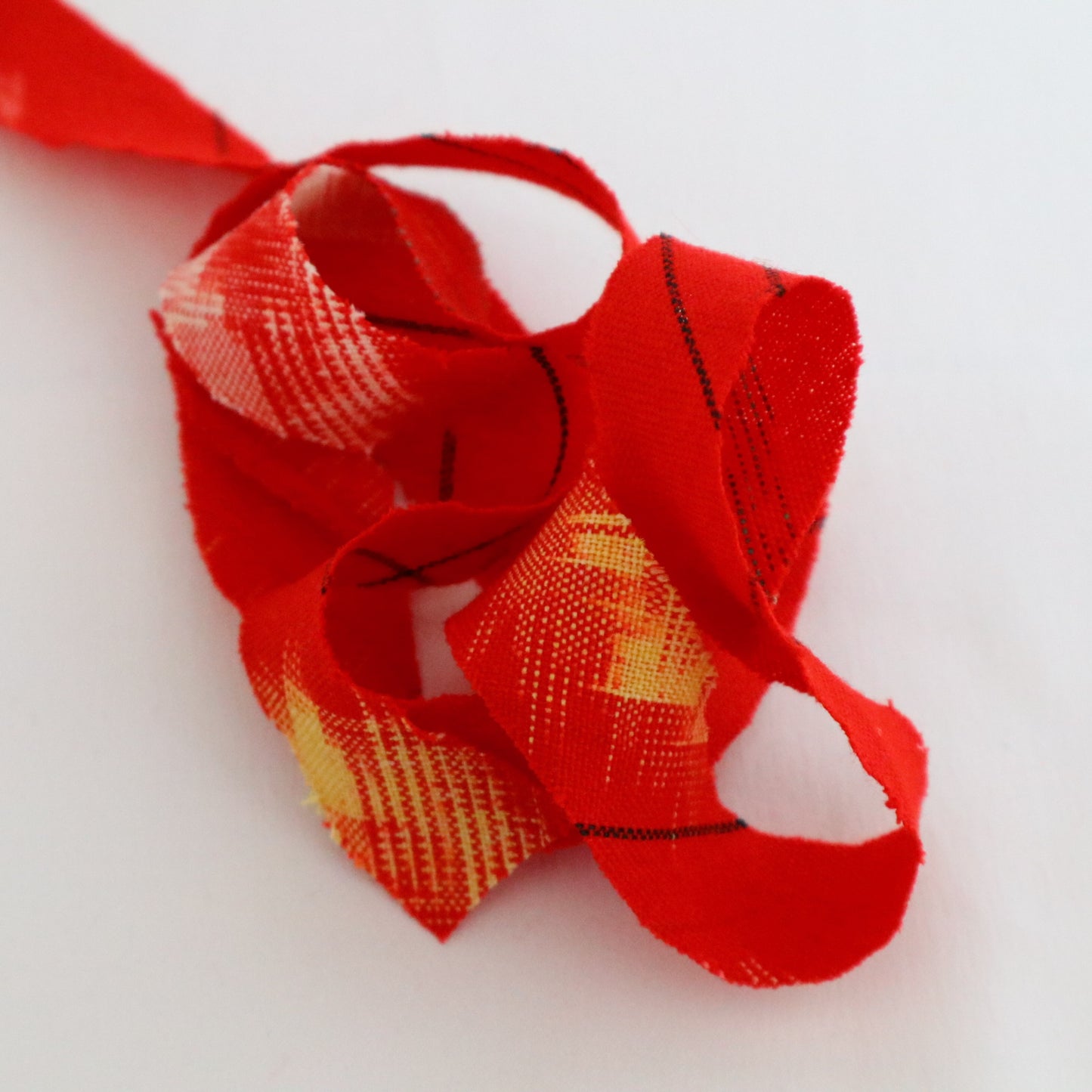 Red with yellow, white, and black ikat pattern, wool (Y02211006)