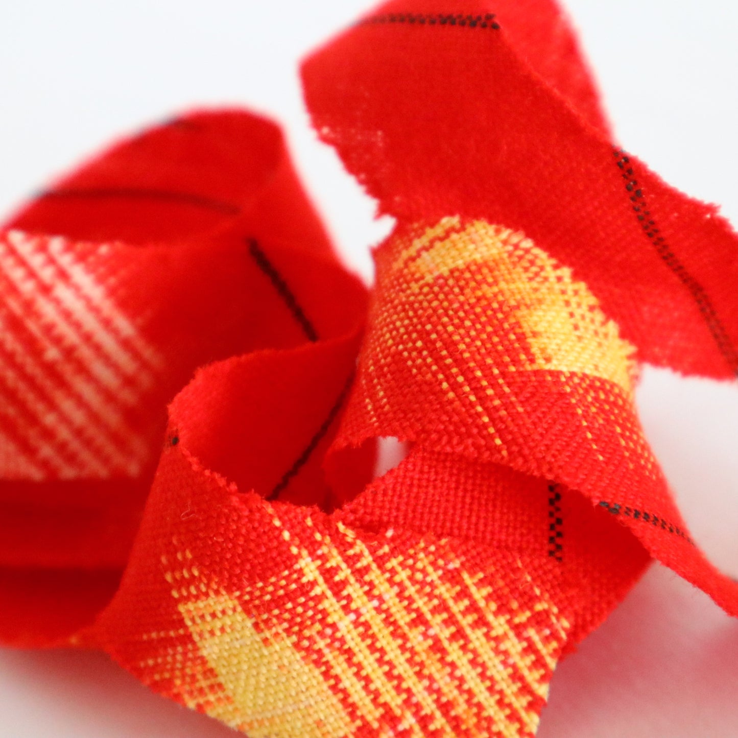 Red with yellow, white, and black ikat pattern, wool (Y02211006)