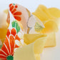 黄色にところどころ鮮やかな吉祥花柄・化繊　(Y02606006）