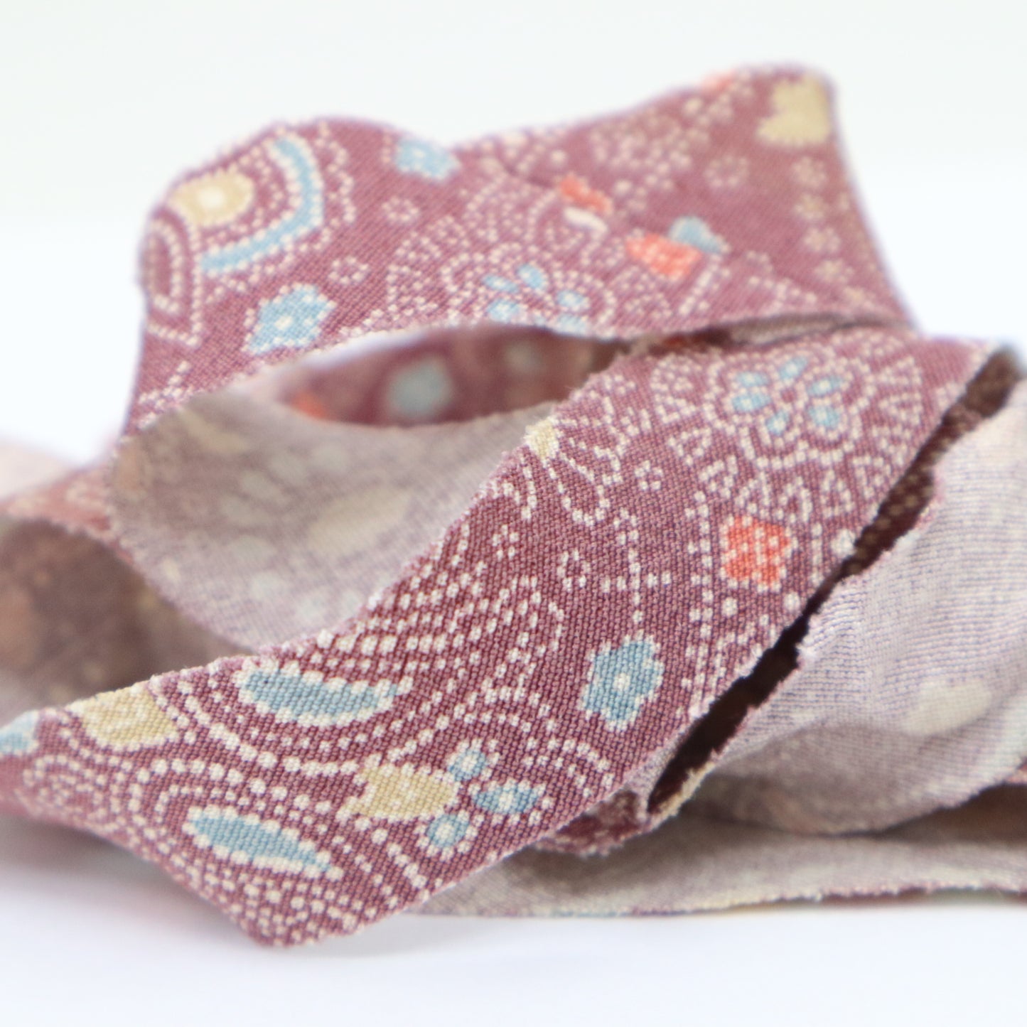 Light purple with light blue, pink and yellow floral pattern, crepe (Y02404024)