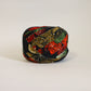 Muslin with red, yellow and green floral pattern on a black background (Y02507003)