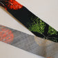 Muslin with red, yellow and green floral pattern on a black background (Y02507003)