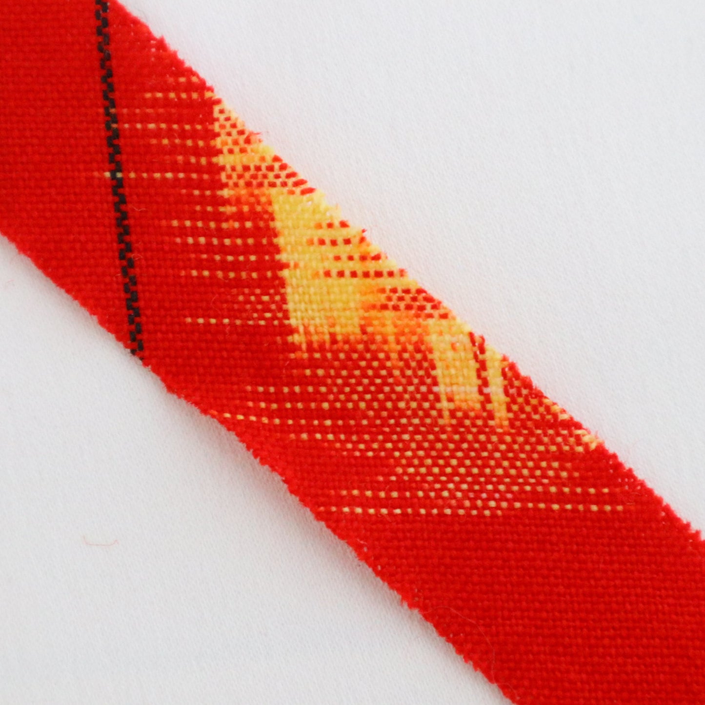 Red with yellow, white, and black ikat pattern, wool (Y02211006)
