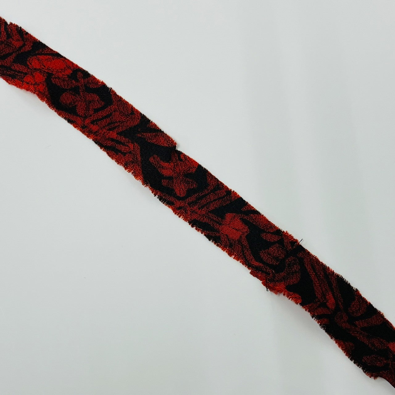 [2m yarn available] Black with red abstract pattern, wool (Y02003036)